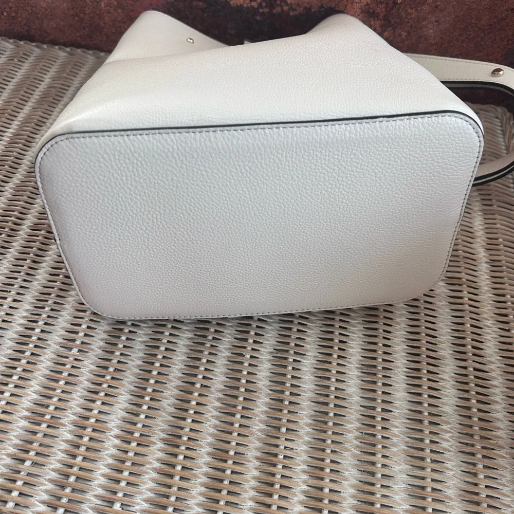 Kate Spade New York Marti large bucket bag in white pebbled leather.